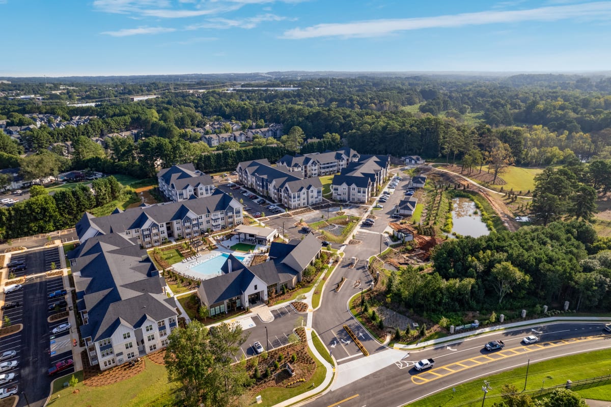Celadon on Club Apartments aerial view with central pool - Lawrenceville, GA