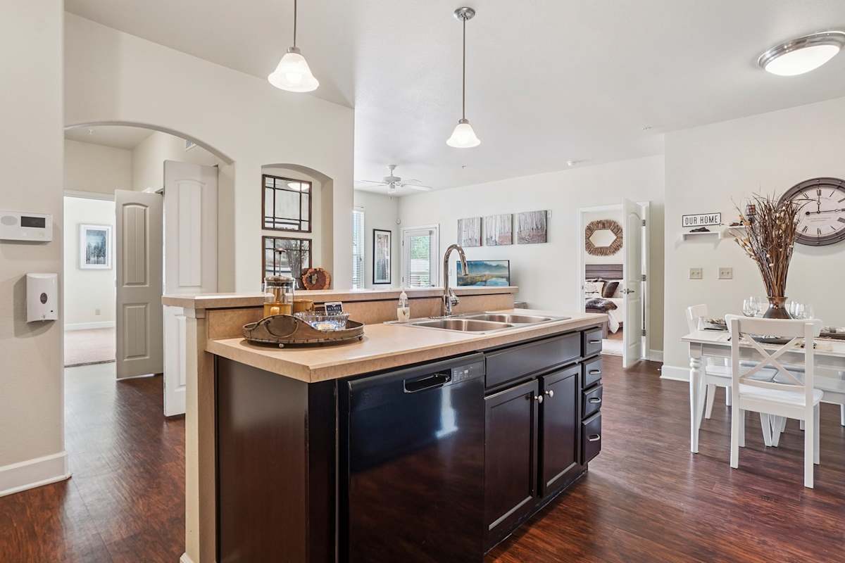 Trail Ridge at Woodland Park Apartments kitchen island and dishwasher - Woodland Park, CO