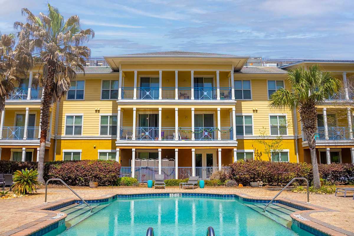 The Altair Senior Apartment Living pool deck seating - Pensacola, FL
