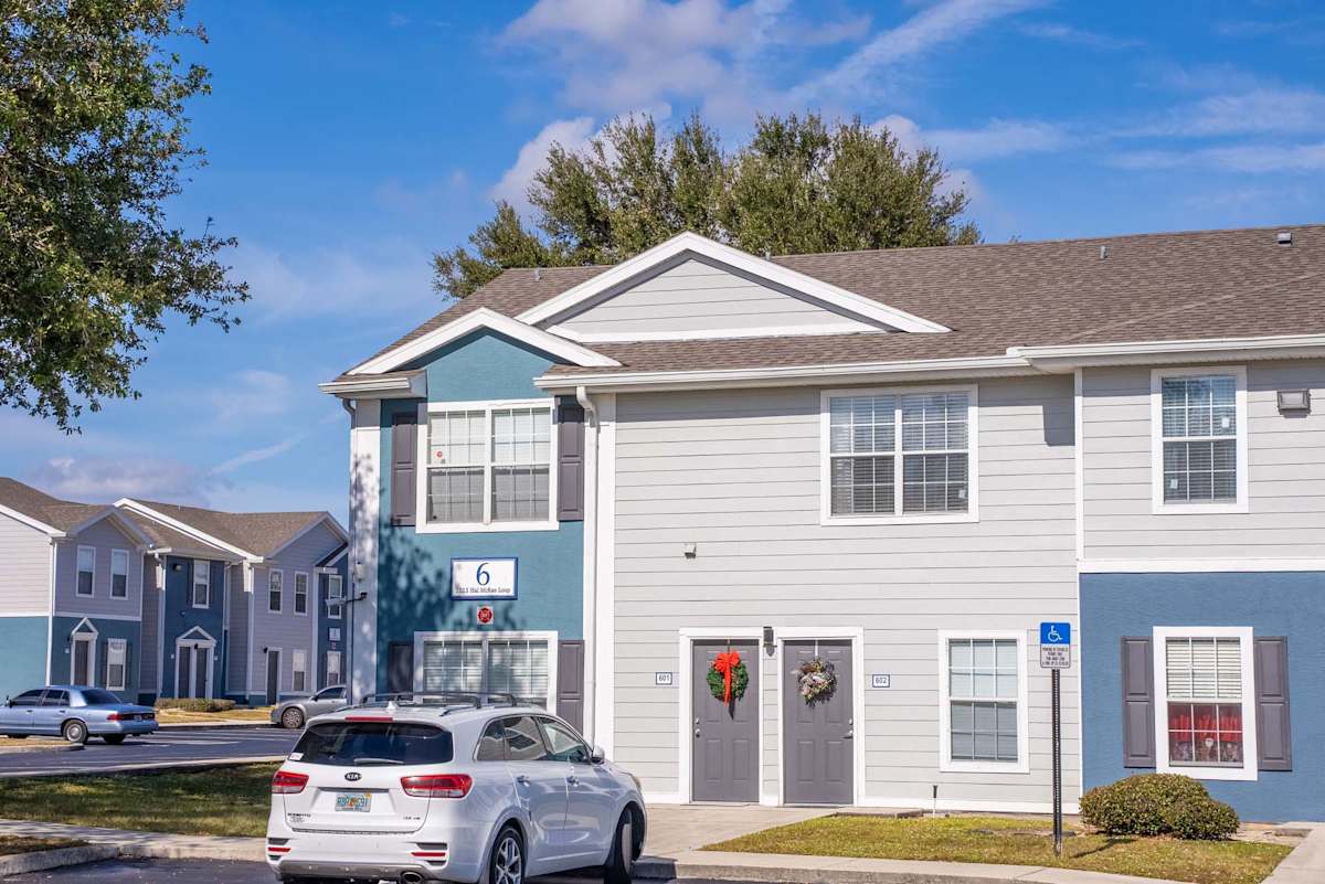Altair at Lake Tulane Apartments exterior with parking - Avon Park, FL