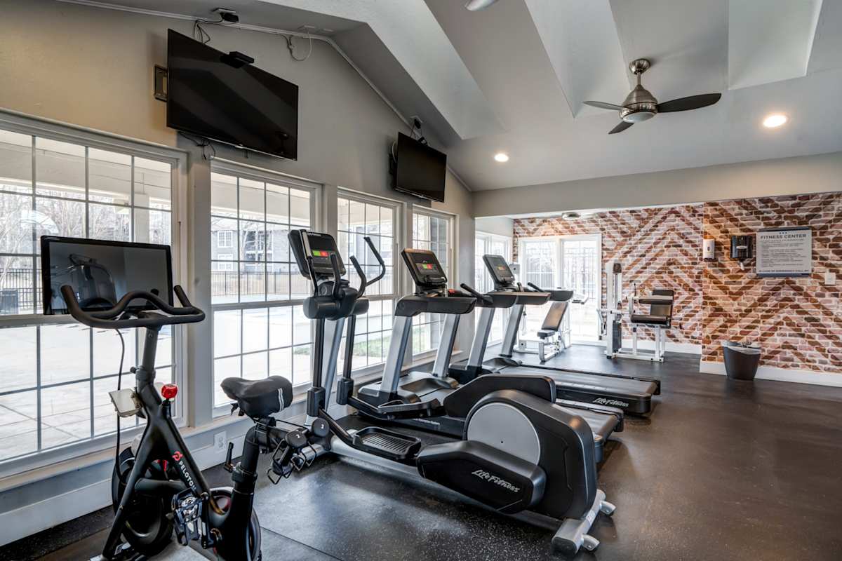 Amberton Apartments fitness center with cardio equipment - Manassas, VA