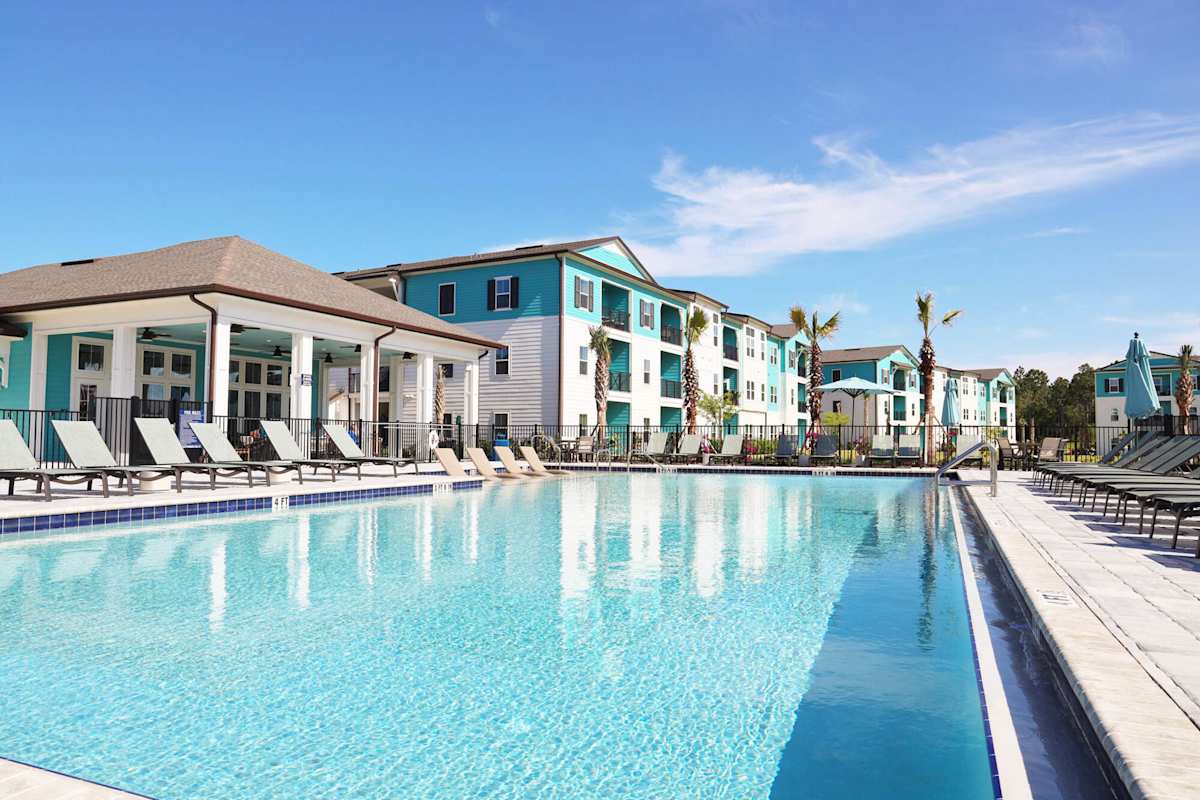 Preserve at Flagler Beach Apartments pool with clubhouse view - Flagler Beach, FL