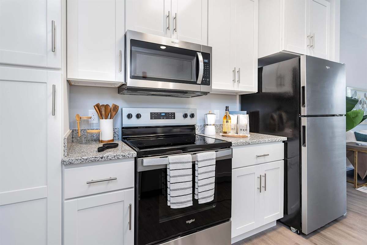 The Retreat Apartments kitchen with stainless appliances - Wyoming, MI