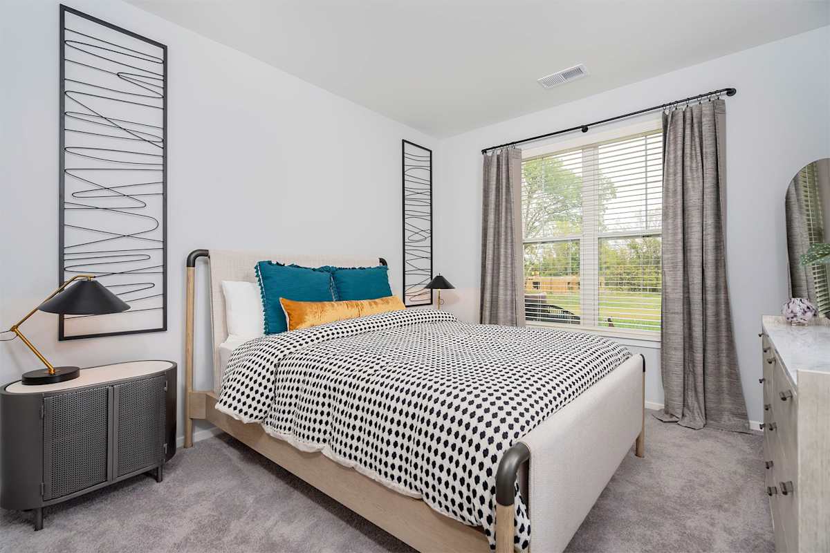 The Retreat Apartments bedroom with carpet flooring - Wyoming, MI