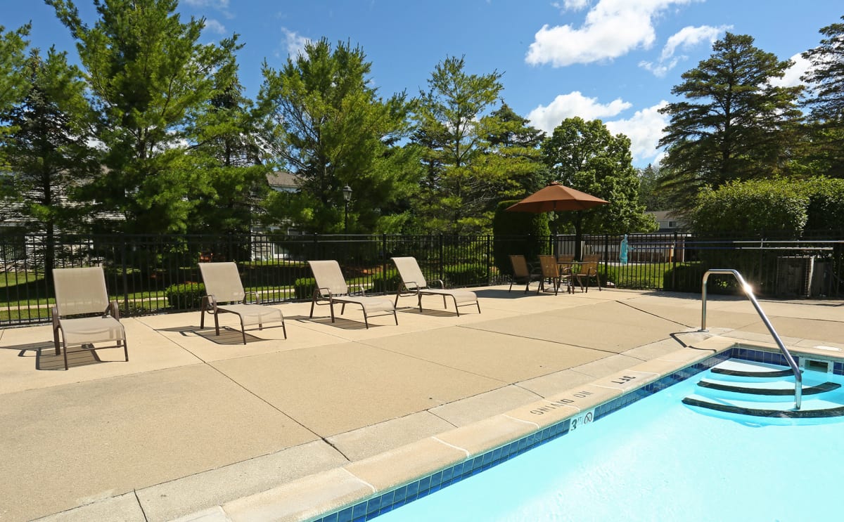 Pheasant Run swimming pool with lounge chairs - Saginaw, MI