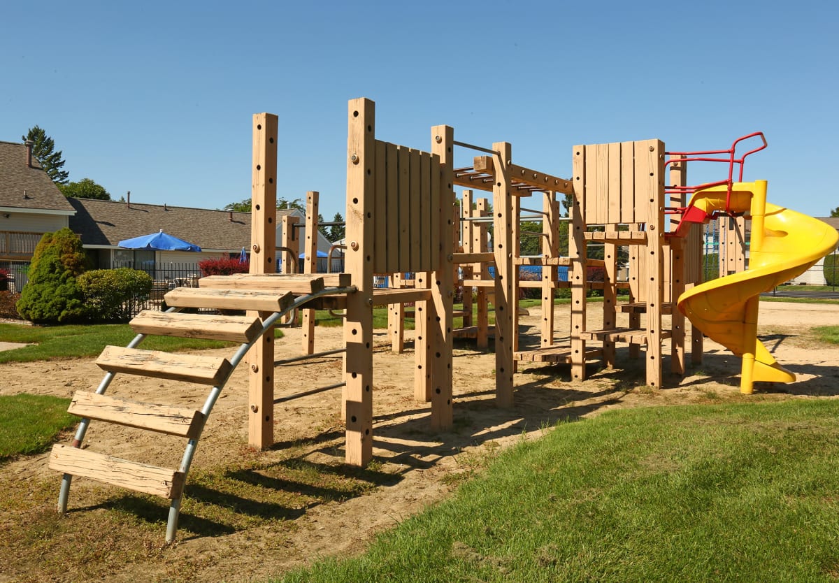 Waters Landing Apartments playground with slide - Saginaw, MI