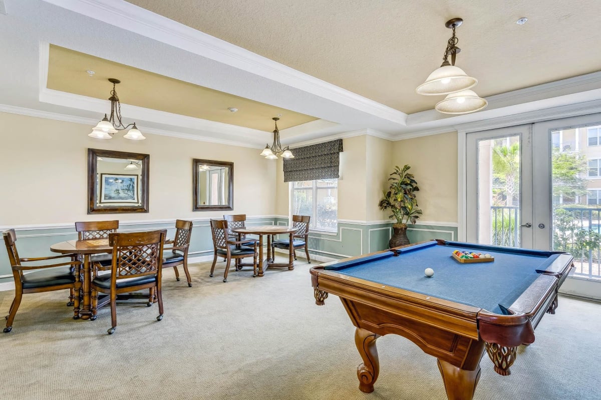 The Altair Senior Apartment Living game room with pool table - Pensacola, FL