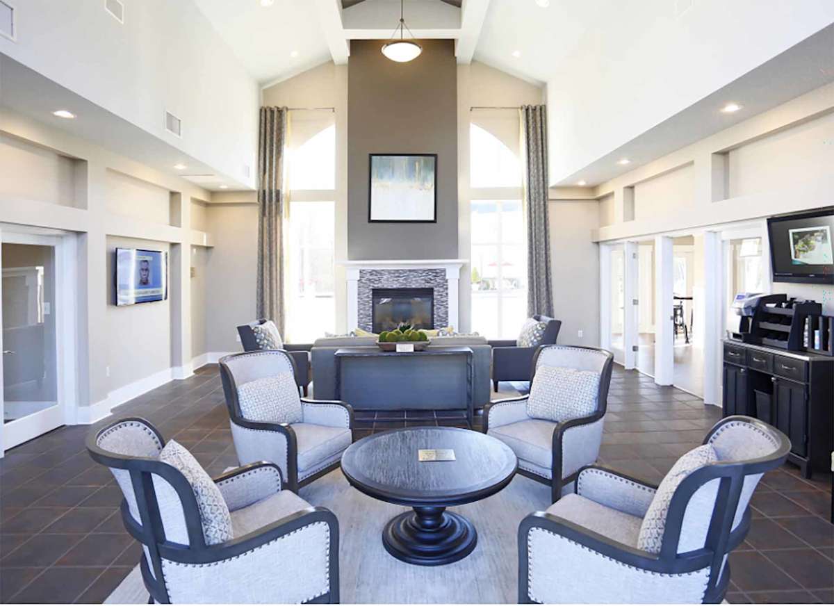 Coffey Creek Apartments living room with fireplace and TV - Charlotte, NC