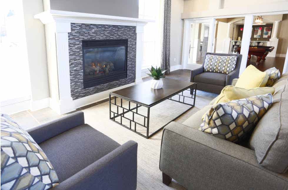 Coffey Creek Apartments living room with fireplace and sofa - Charlotte, NC
