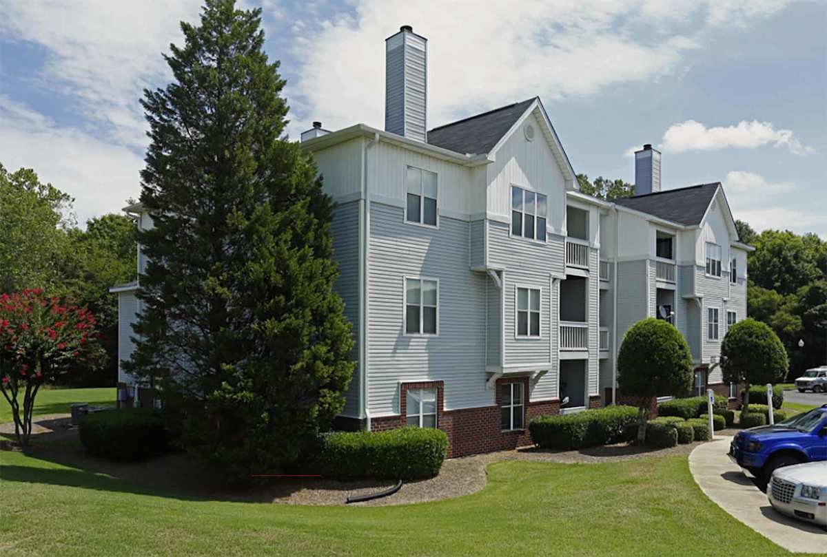 Coffey Creek Apartments exterior building and parking area - Charlotte, NC