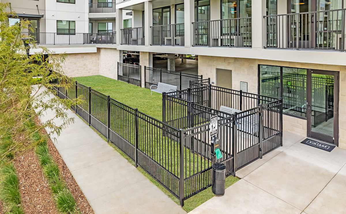 Vintage Lake Mary Apartments dog park fenced lawn - Sanford, FL