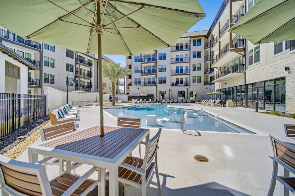 Vintage Lake Powell Apartments pool deck seating - Panama City Beach, FL