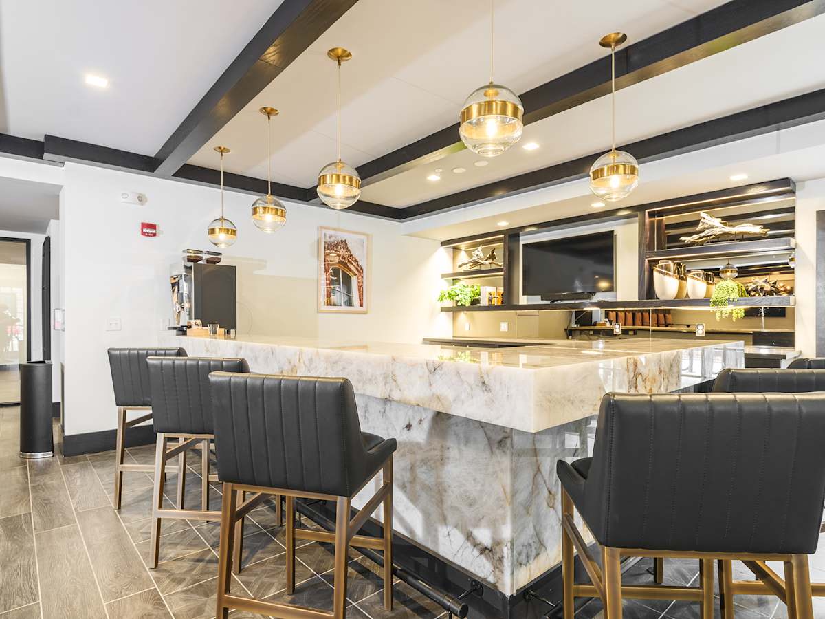 Capital Collective clubhouse bar area with counter seating - Savannah, GA