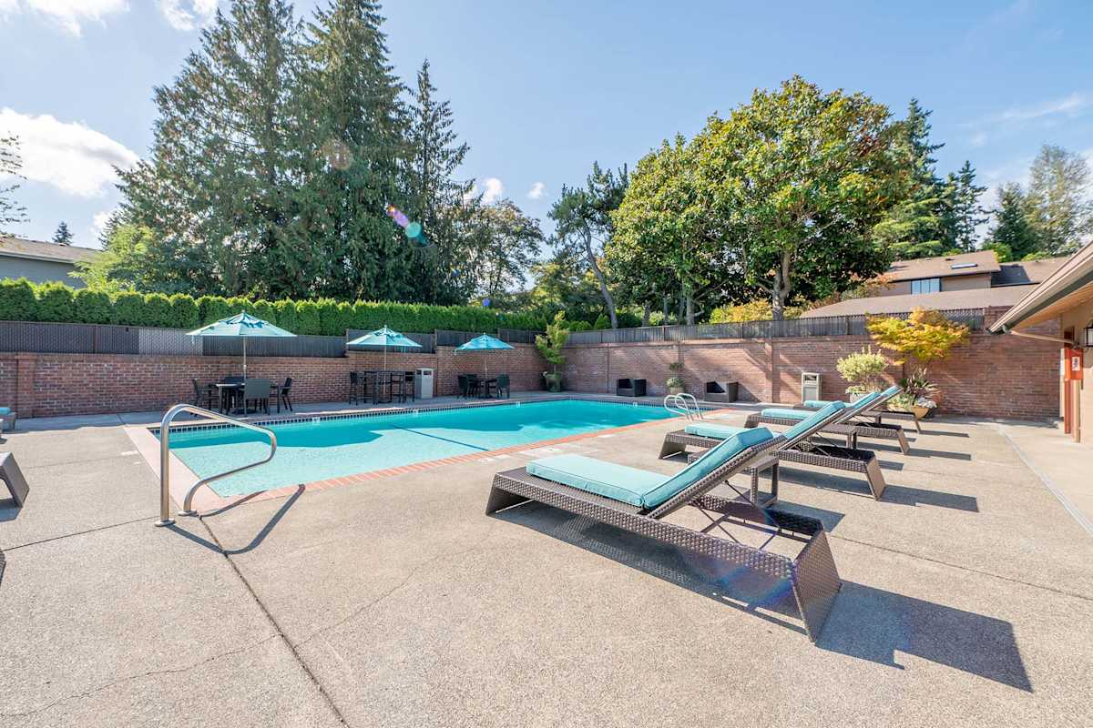 The Regent at Bellevue Way Apartments seasonal outdoor pool and loungers - Bellevue, WA