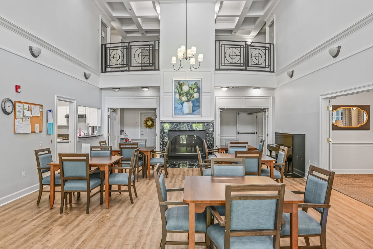 Highland Court Senior Living Apartments dining room with fireplace - Kennesaw, GA