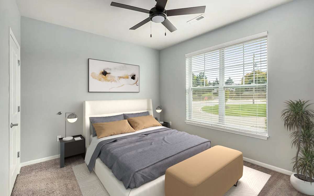 The Haven Apartments bedroom with ceiling fan and large window - Wyoming, MI