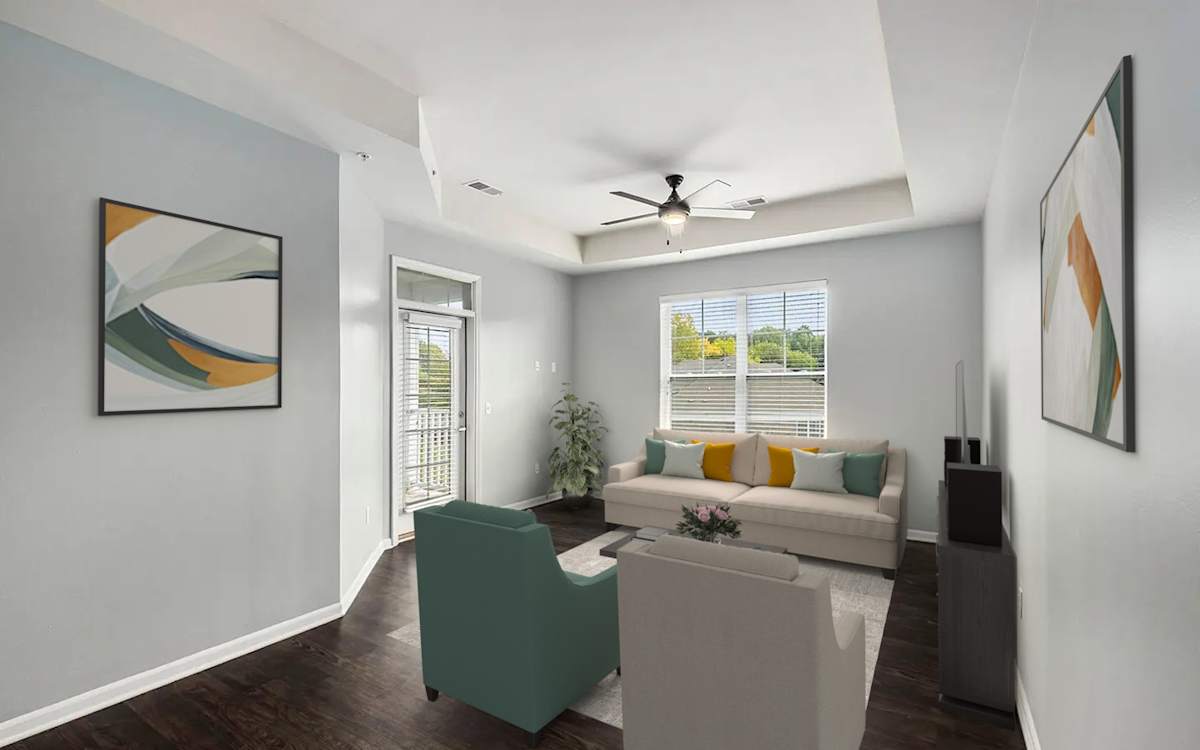 The Haven Apartments living room with tray ceiling and balcony door - Wyoming, MI