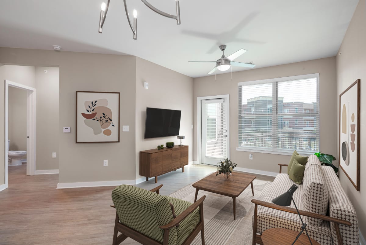 The Enclave at Providence Luxury Apartments living room with balcony access - Mt. Juliet, TN