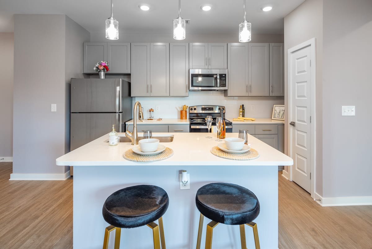 The Enclave at Providence Luxury Apartments kitchen with island and stainless appliances - Mt. Juliet, TN