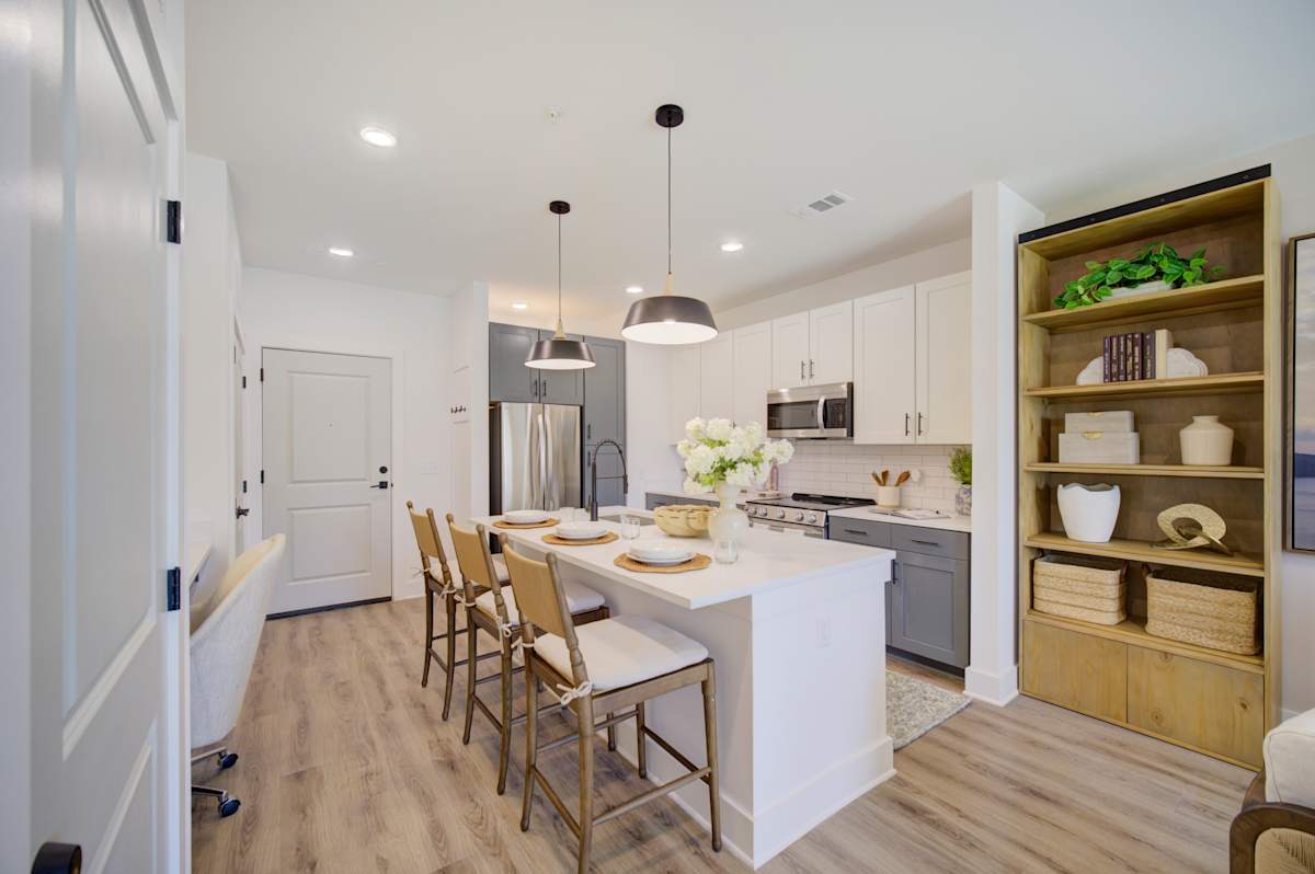 Vintage Lake Powell Apartments kitchen with island and stainless appliances - Panama City Beach, FL
