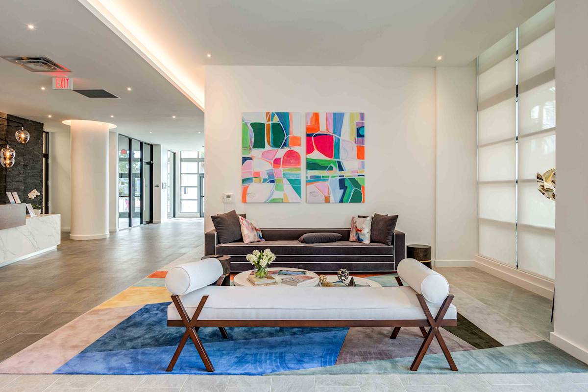 Lazul North Miami Beach Apartments living room with wall art - North Miami Beach, FL