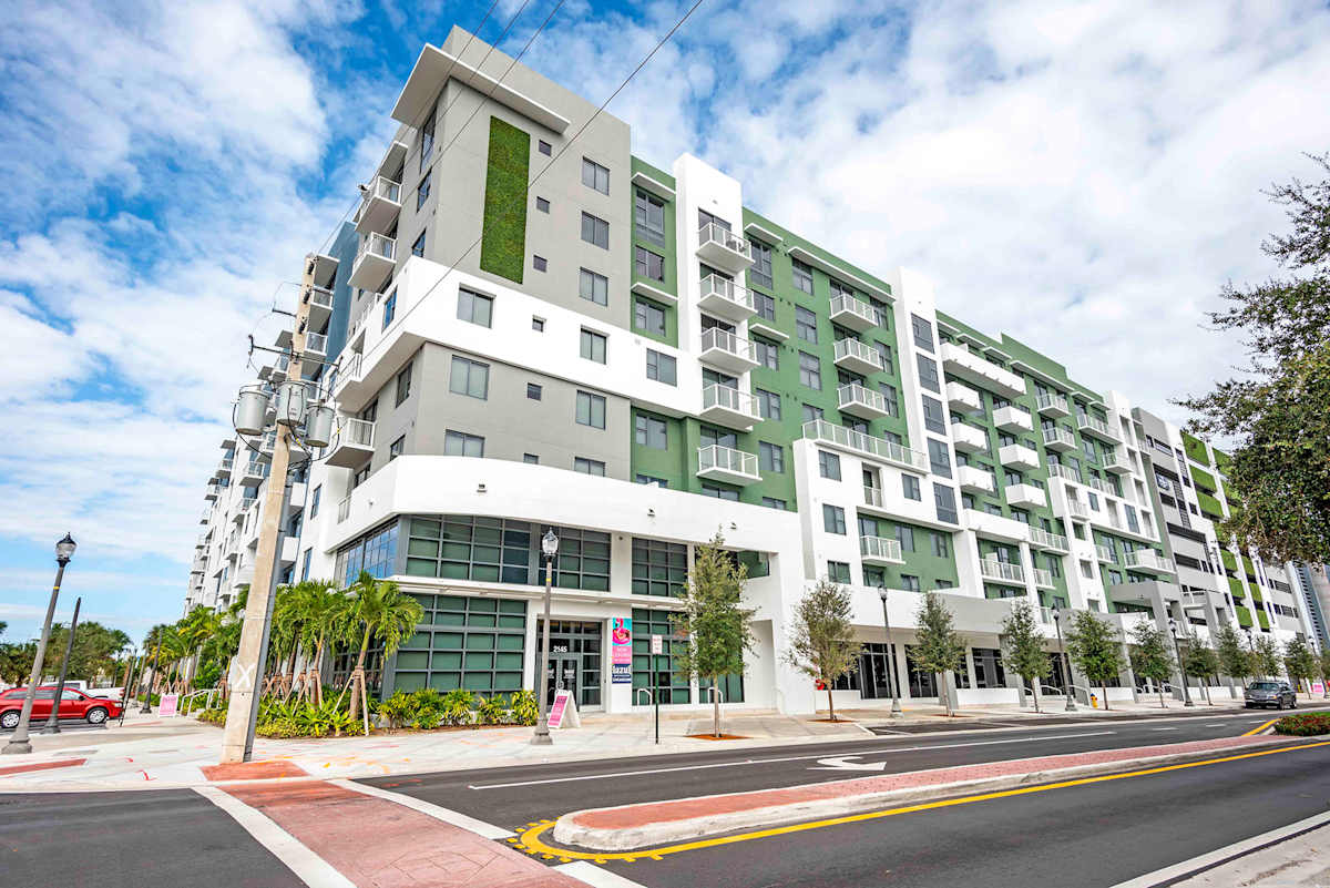 Lazul North Miami Beach Apartments exterior building with green wall - North Miami Beach, FL