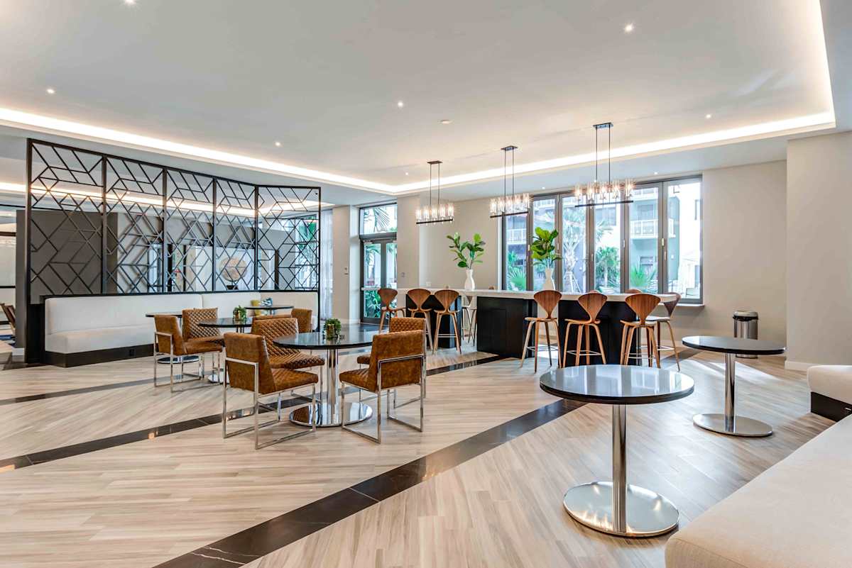 Lazul North Miami Beach Apartments clubhouse dining and seating area - North Miami Beach, FL