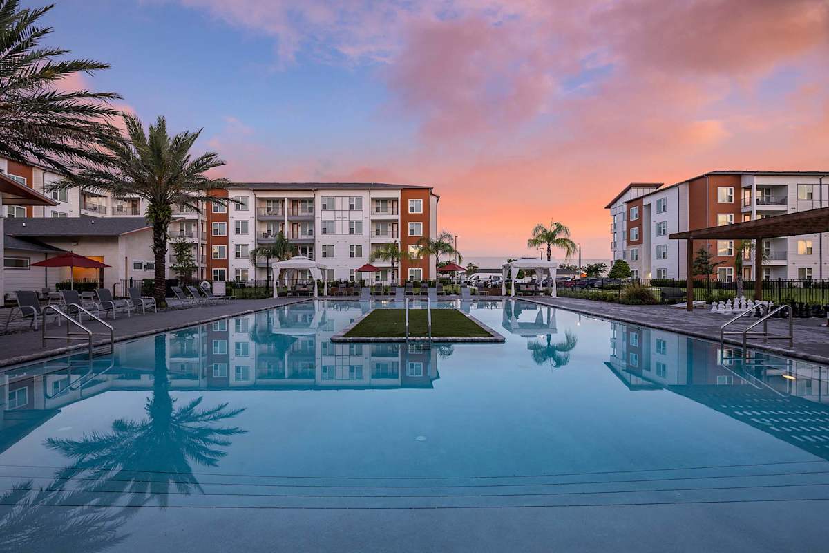 Madison Pointe Apartments pool reflection view - Daytona Beach, FL