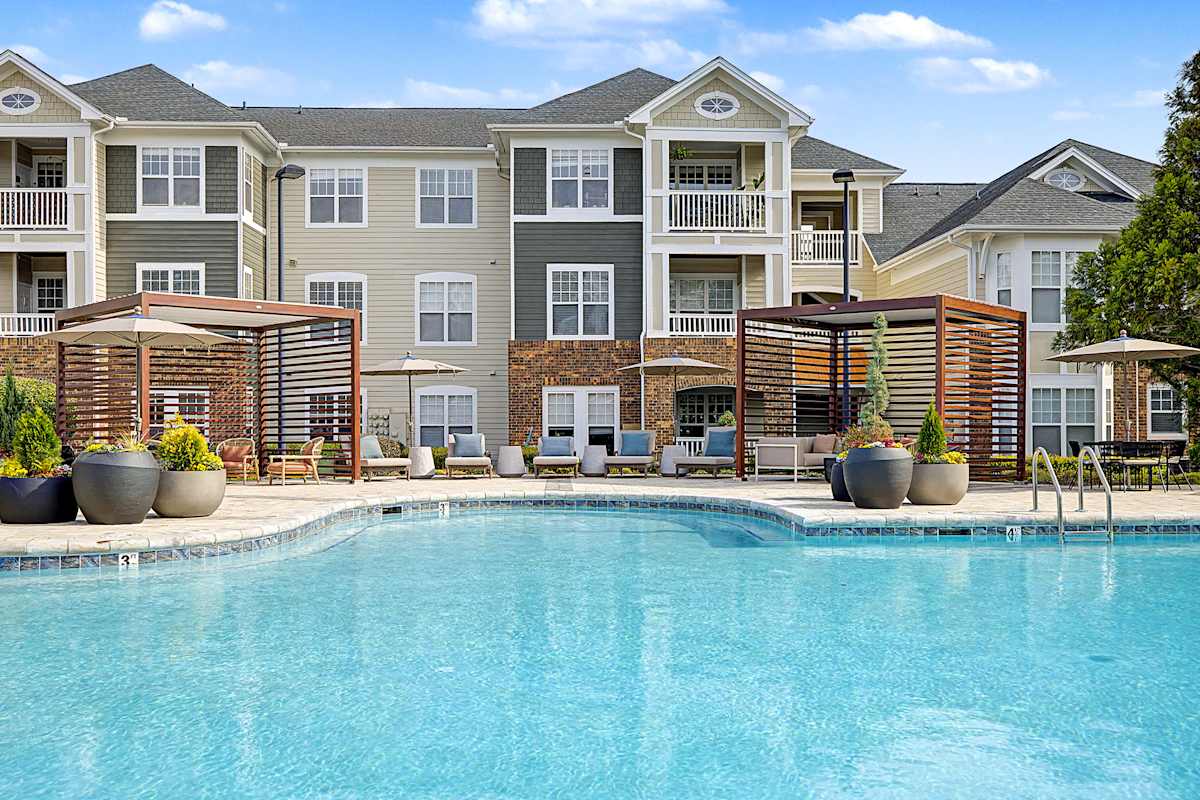 The Reserve at Meadowmont swimming pool with lounge seating and cabanas - Chapel Hill, NC