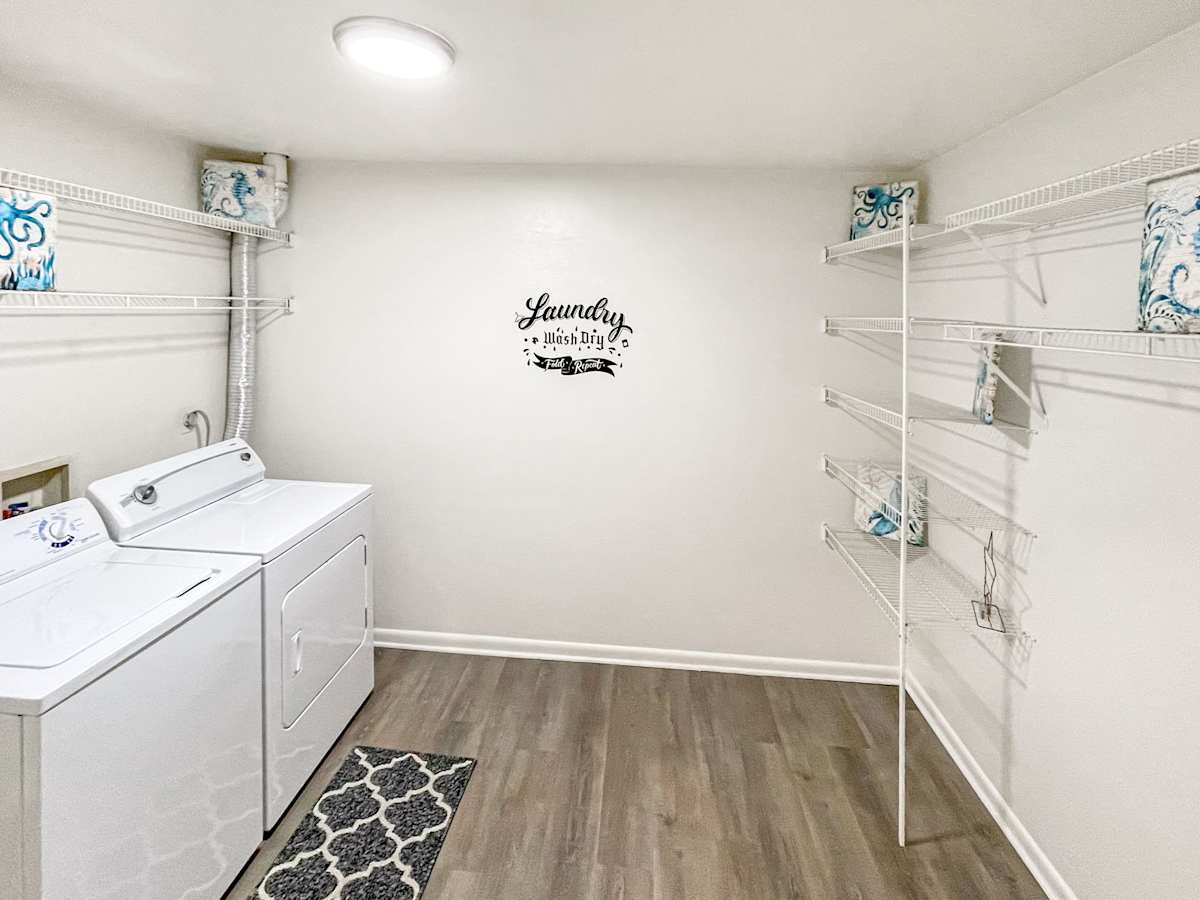 The Mill Apartments laundry room with washer and dryer - Harrisonburg, VA