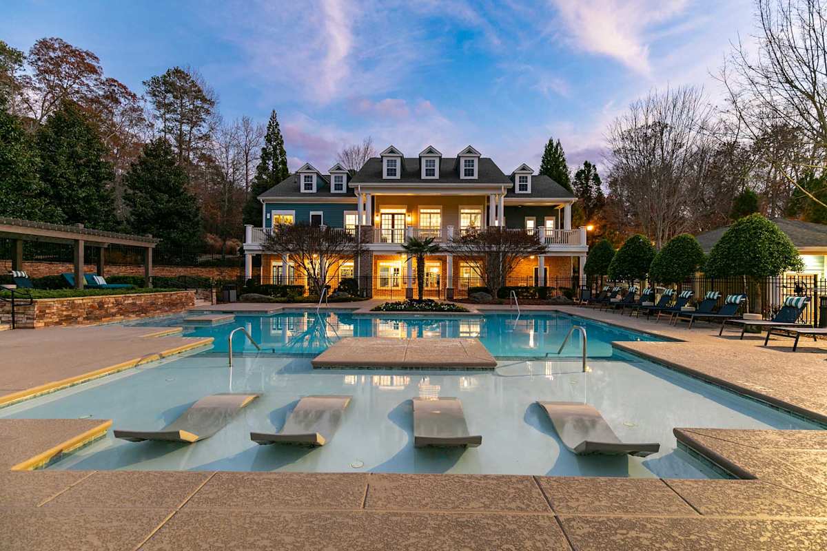 The Jackson Apartments resort-style pool and clubhouse exterior at dusk - Newnan, GA
