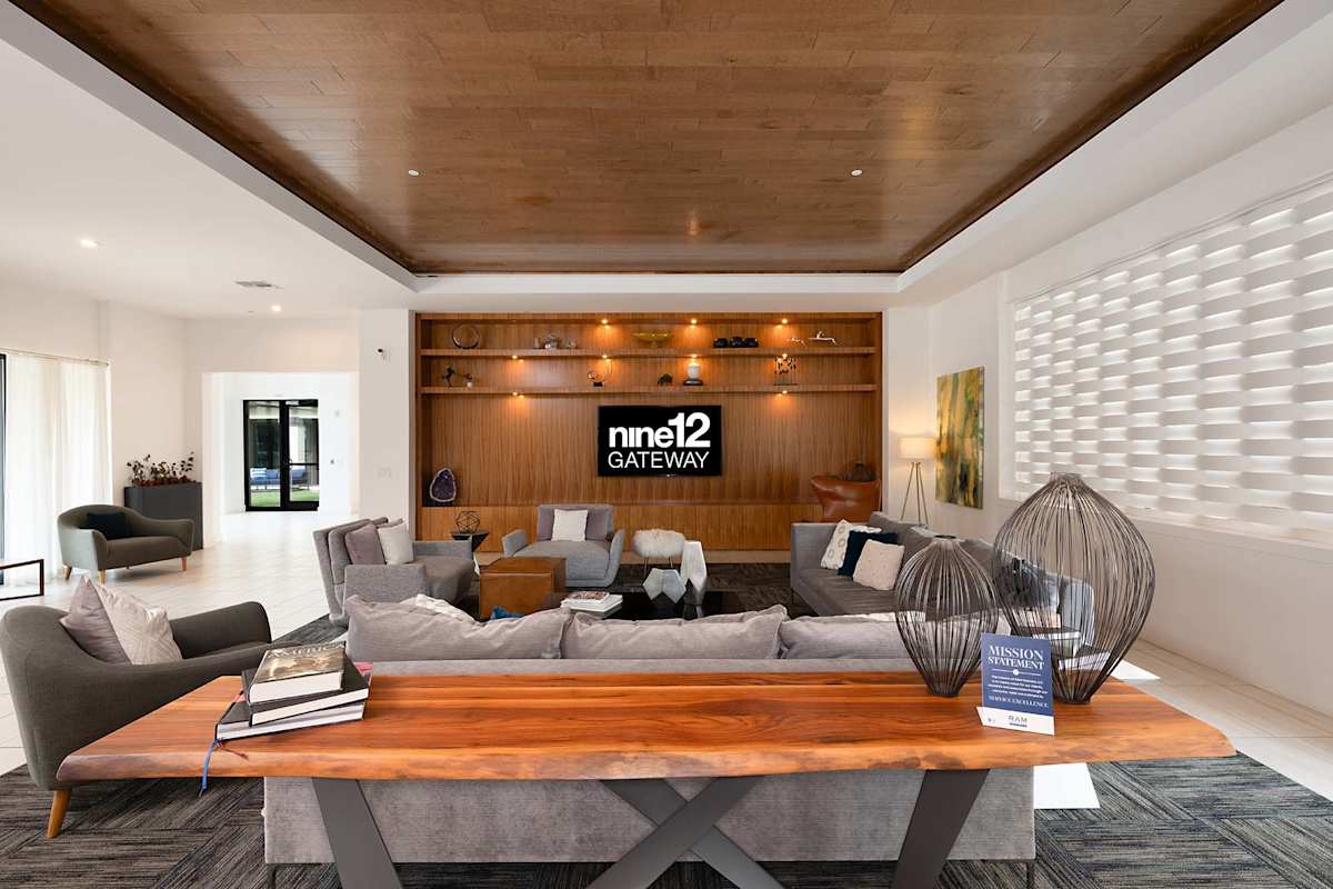 Nine12 Gateway Apartments clubhouse living room seating area - Altamonte Springs, FL