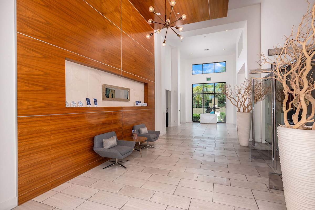 Nine12 Gateway Apartments interior hallway with wood accent wall - Altamonte Springs, FL