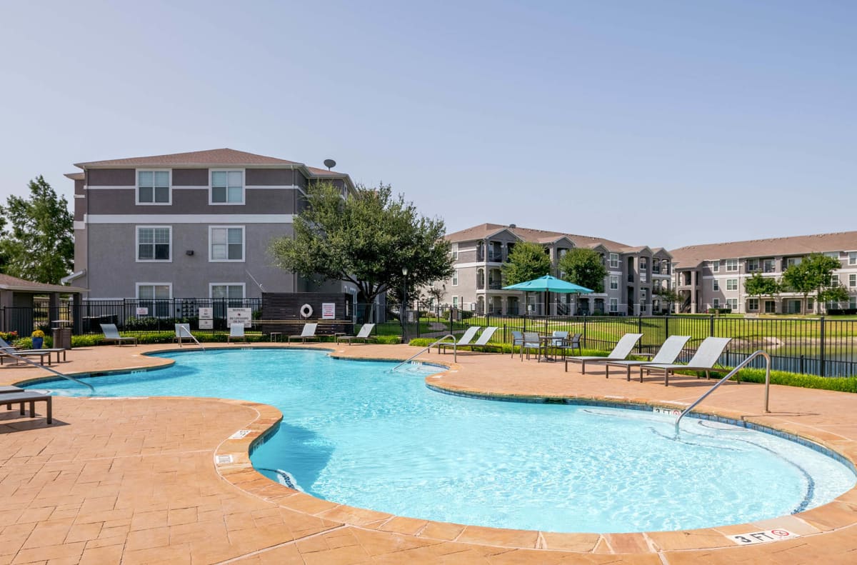 Orion Prosper Apartments pool and building view - Prosper, TX