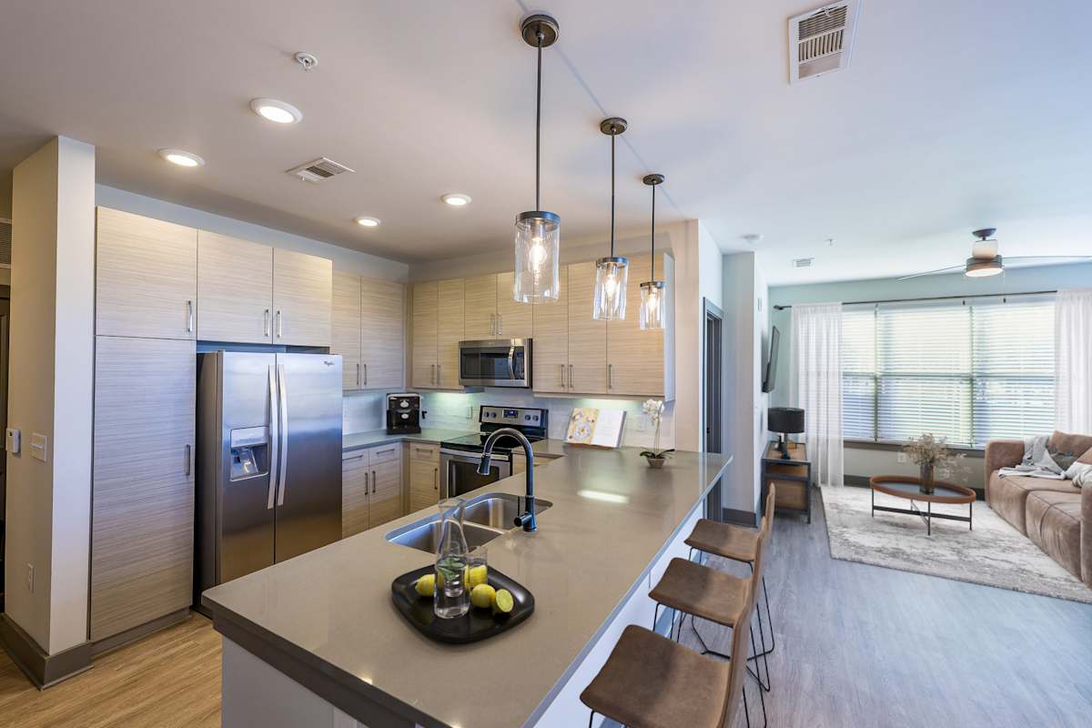 District at Duluth Apartments modern kitchen with island - Duluth, GA