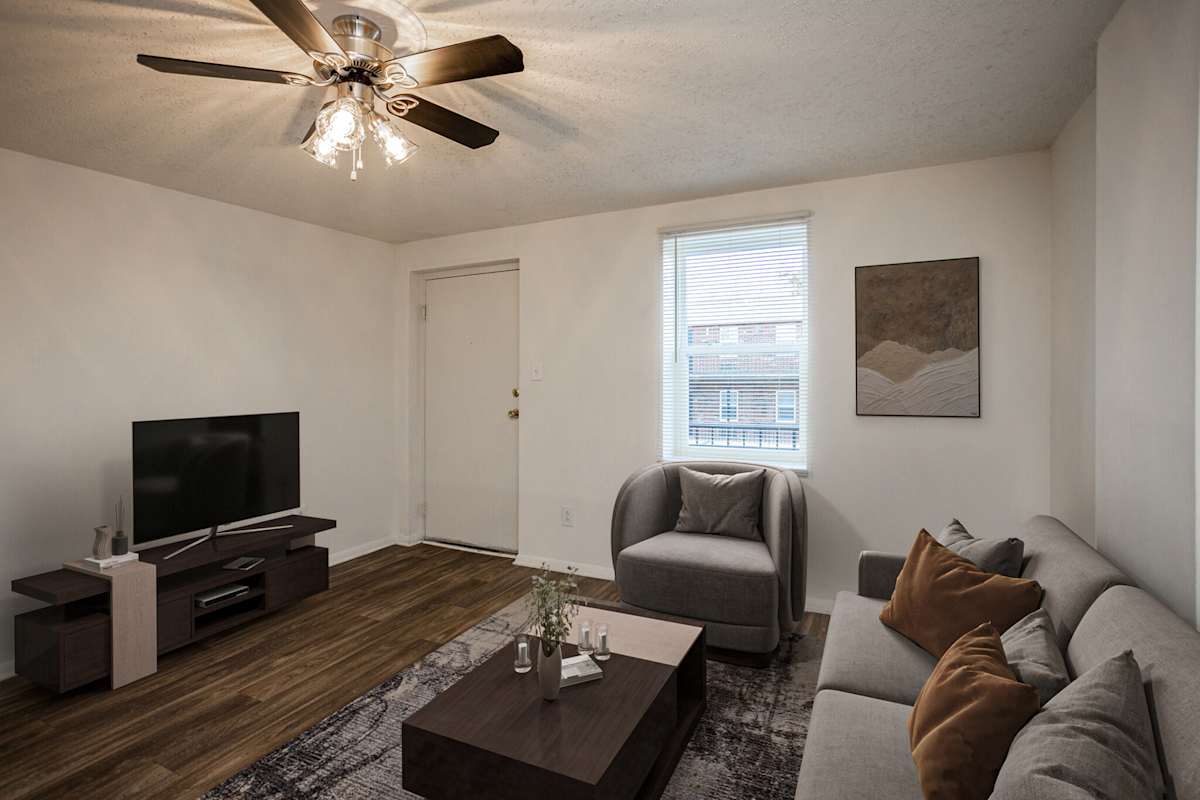 Windsor Court Apartments living room with ceiling fan - Knoxville, TN