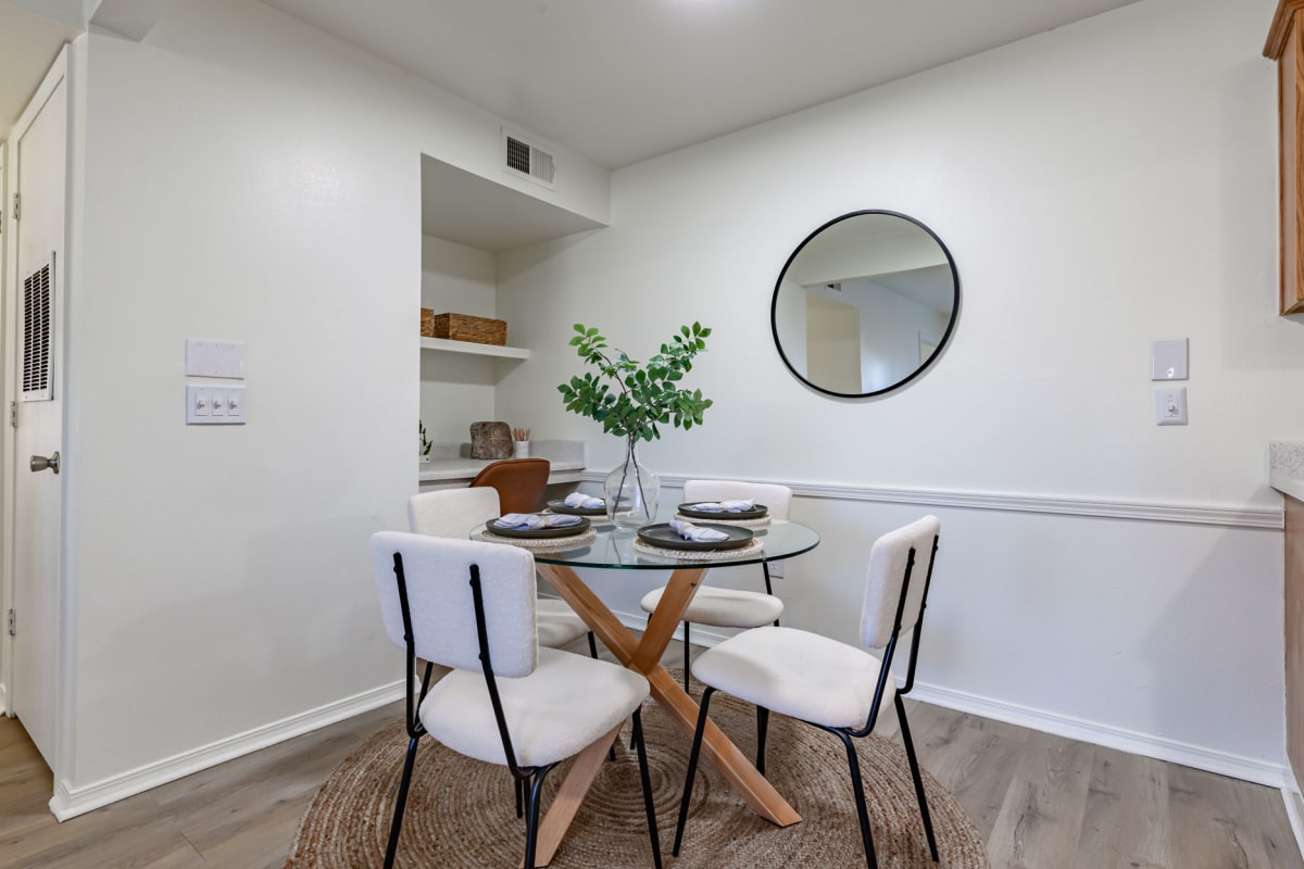 Revive Benton Apartments dining room with glass table - Benton, AR