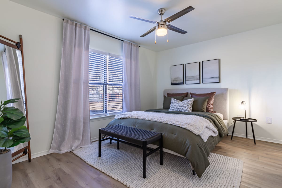 Revive Benton Apartments bedroom with ceiling fan - Benton, AR