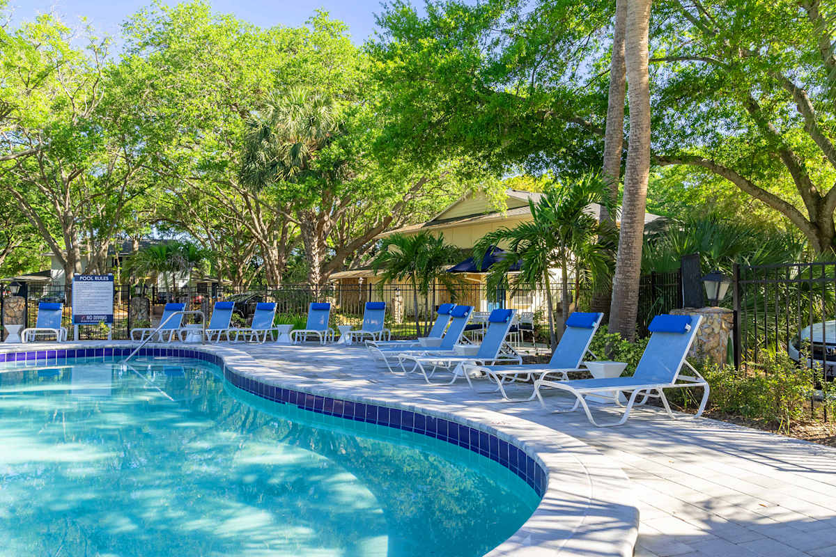 Sherwood Oaks Apartments pool with lounge seating - Riverview, FL