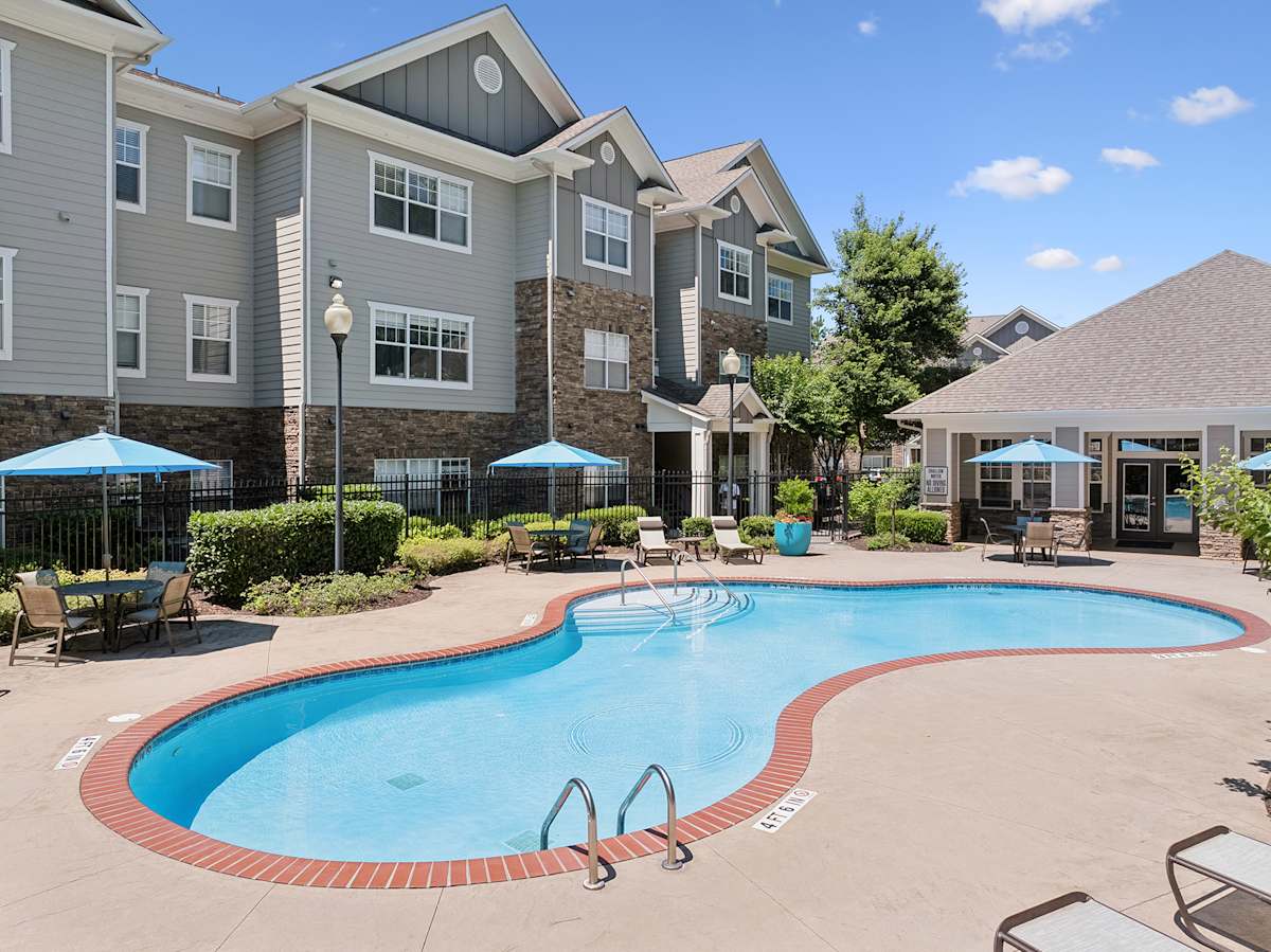 Vintage Retreat Apartments pool area in front of buildings - Cleveland, TN