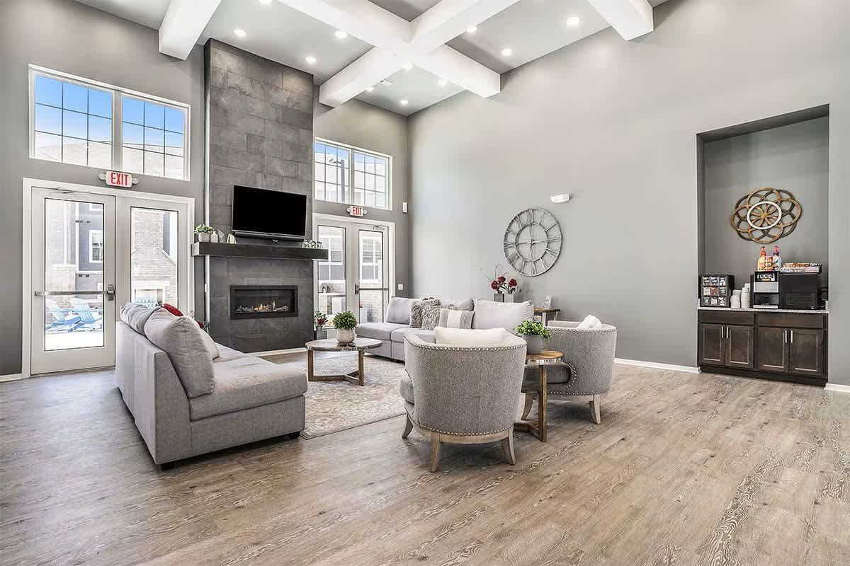 Shoreline Flats Apartments clubhouse lounge with fireplace - Holland, MI