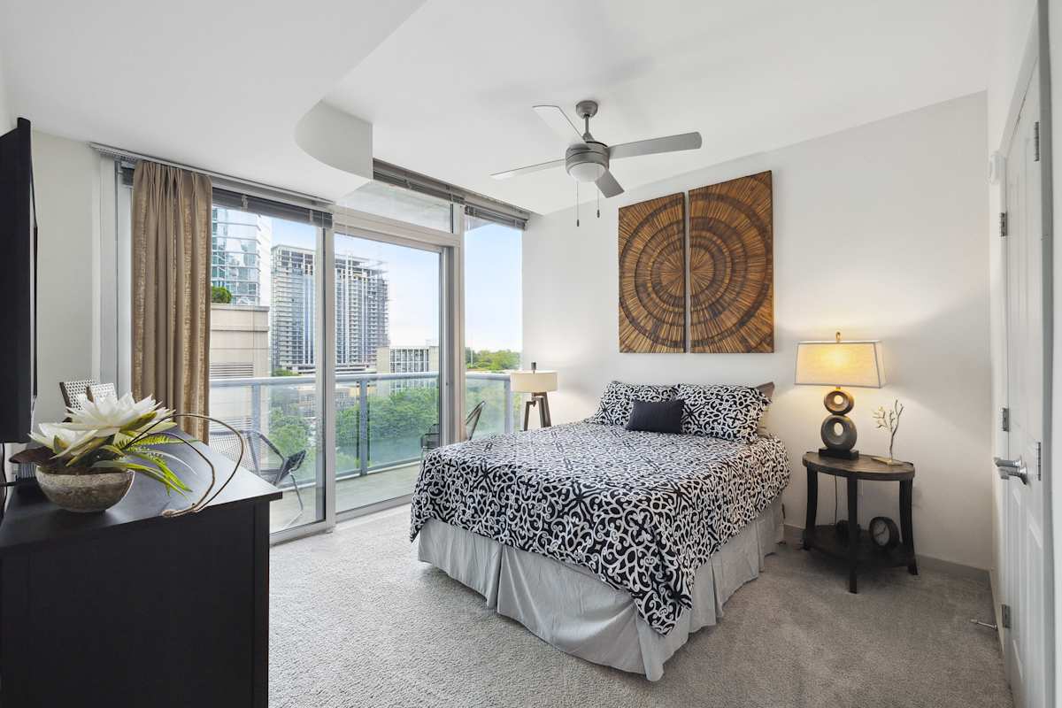 Sixty 11th unit bedroom with large bed - Atlanta, GA