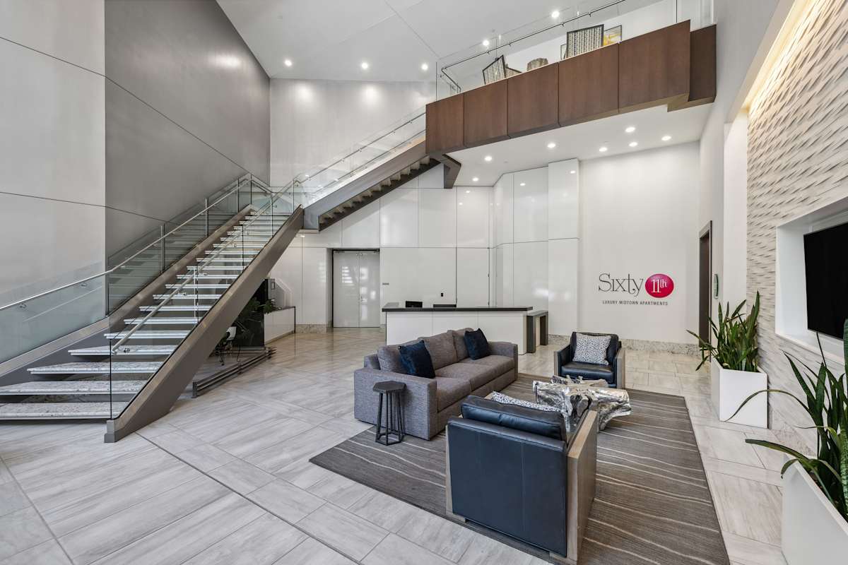 Sixty 11th interior leasing office lounge with staircase - Atlanta, GA