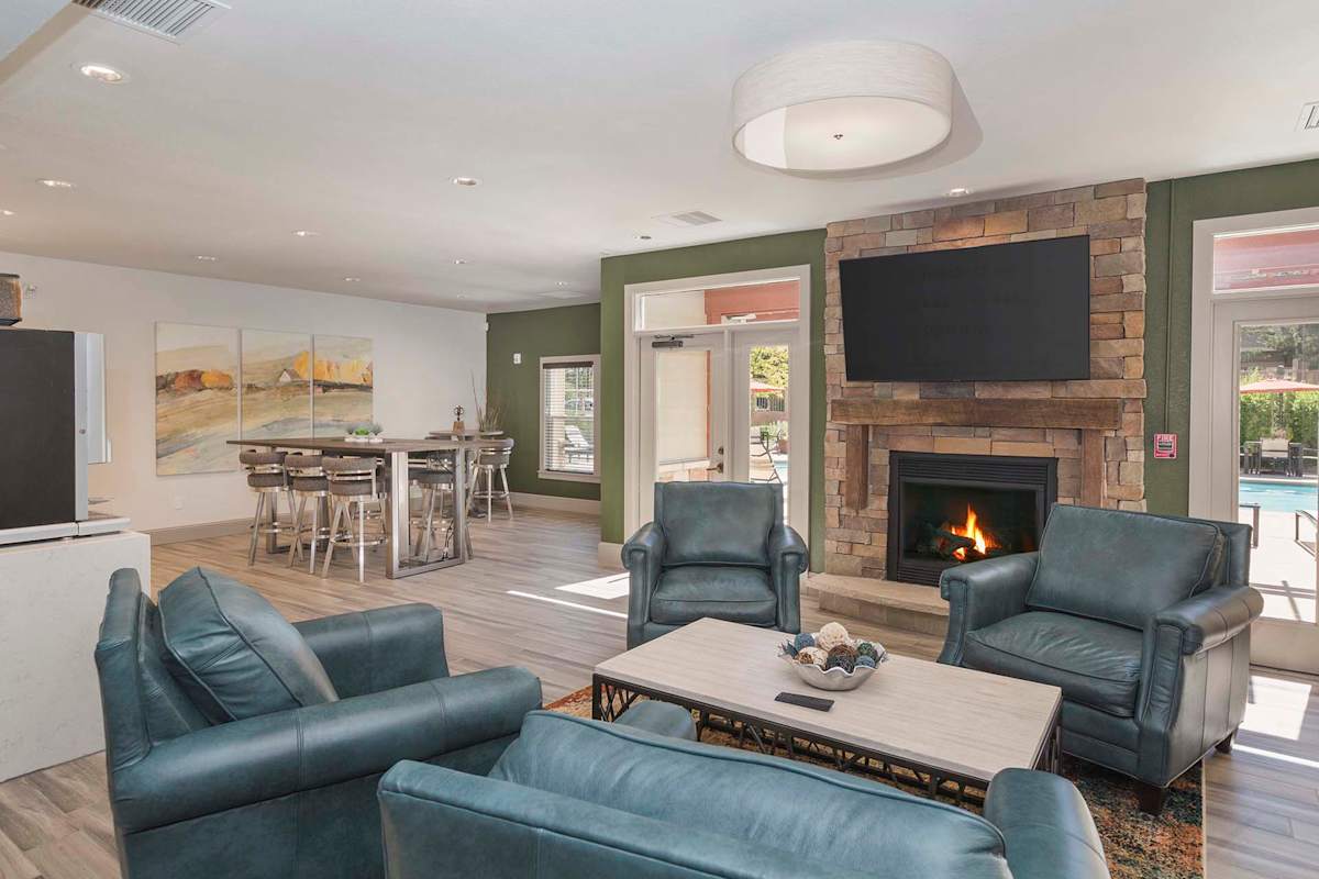 Stetson Ridge Apartments clubhouse lounge with fireplace - Colorado Springs, CO