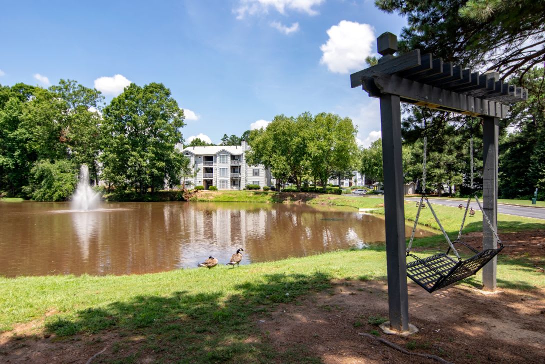 Sutter Lake Apartments lakeside swing by the pond - Riverdale, GA