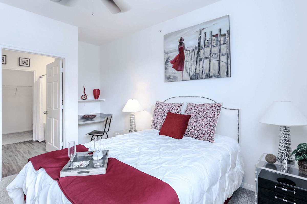 The Cove Apartments bedroom with ceiling fan - Ingleside, TX