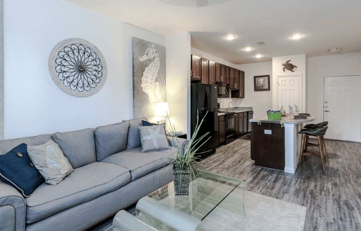 The Cove Apartments living room seating area - Ingleside, TX