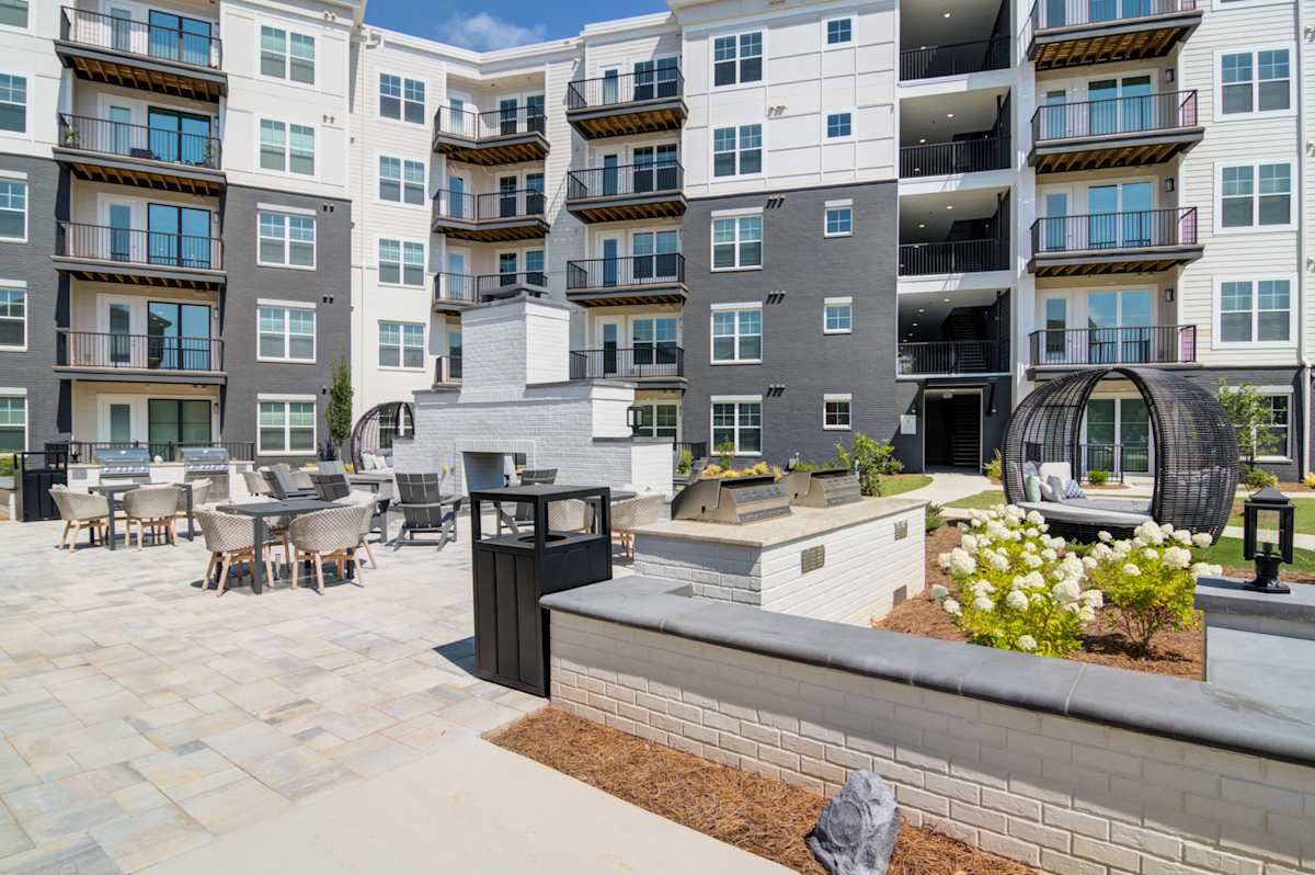 The Collier Sugar Hill Luxury Apartments courtyard fire pit area - Sugar Hill, GA