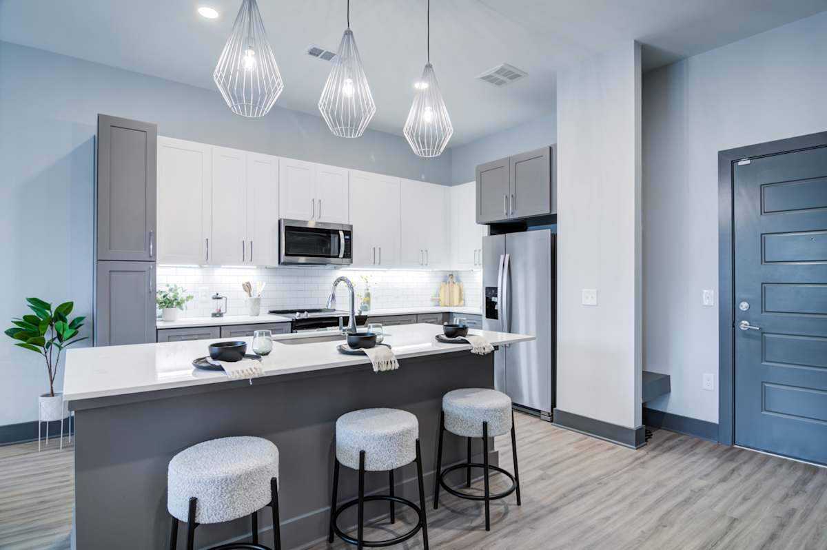 The Collier Sugar Hill Luxury Apartments kitchen with island seating - Sugar Hill, GA