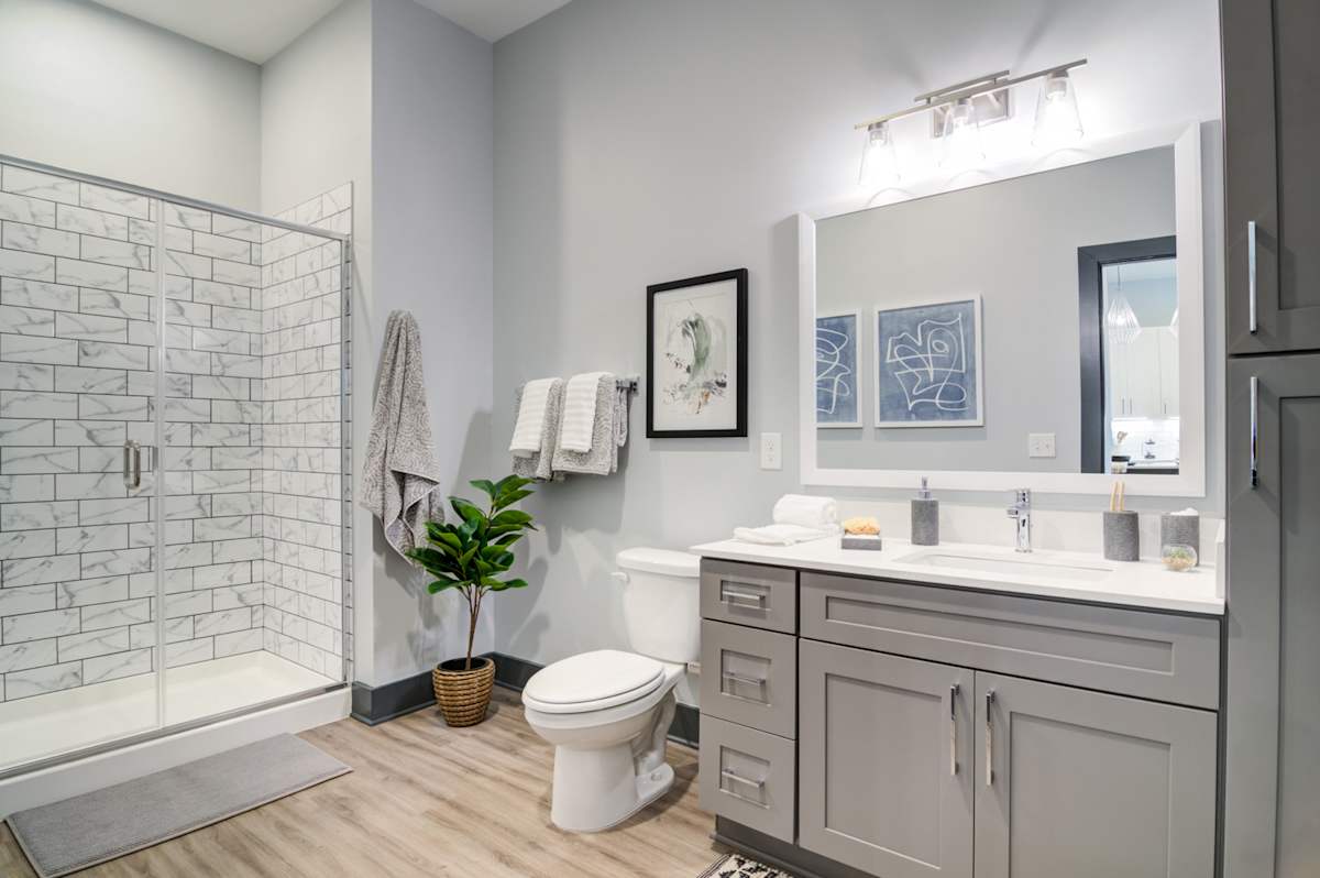 The Collier Sugar Hill Luxury Apartments bathroom with glass shower - Sugar Hill, GA